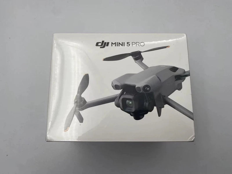 Gray DJI Mini 5 Pro drone in retail box, front view