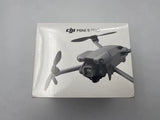 Gray DJI Mini 5 Pro drone in retail box, front view