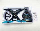 Black FPV quadcopter drone with attached FPV camera module and props on tray