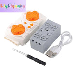 APP-enabled 8-way remote battery box kit with orange buttons, USB cable, and screwdriver