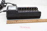 Black universal AA/AAA battery charger with multiple charging slots and indicator lights