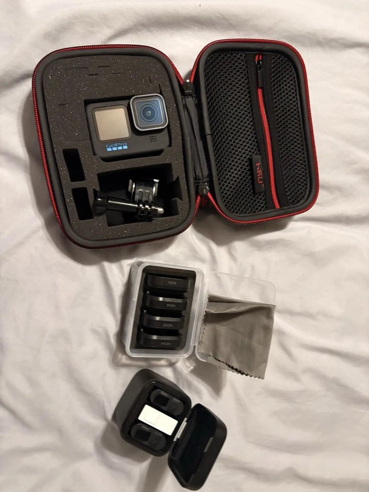 GoPro HERO11 Black action camera accessories set with open hard case and mounts