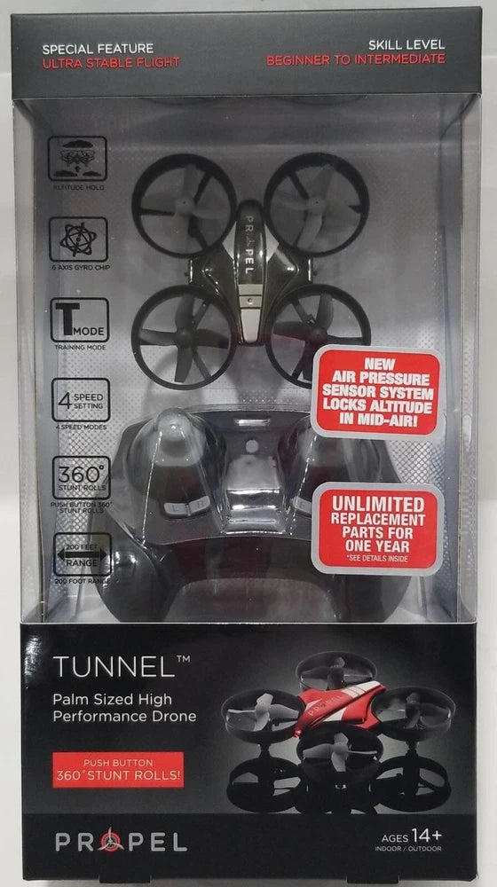 Palm-sized black quadcopter drone in clear retail packaging, visible red accents