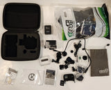 Silver action camera in open case with mounts, cables, and extra accessories