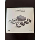 DJI Mavic Mini combo box showing drone, controller, batteries, and carry case