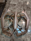 Gray quadcopter drone with four propellers on an open hexagonal frame