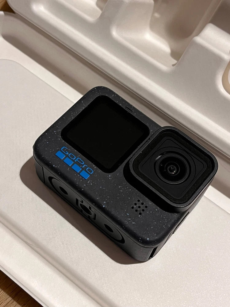 GoPro waterproof action camera, black body with front lens and touchscreen
