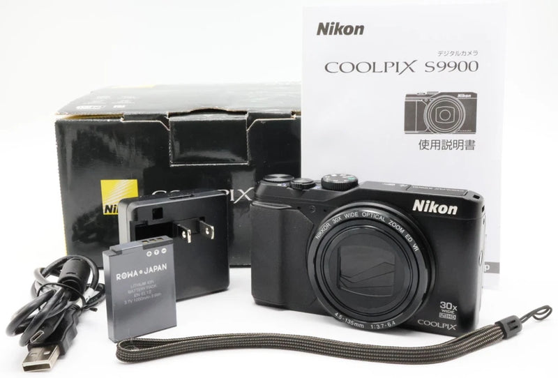 Black Nikon COOLPIX S9900 compact digital camera with lens and top buttons