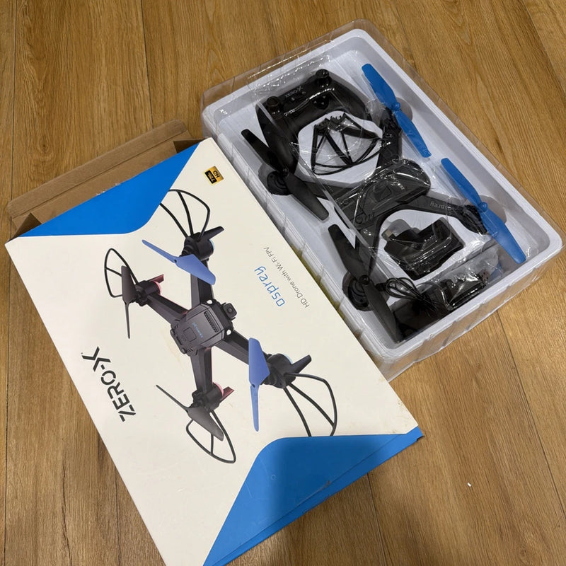 HD WiFi drone in clear plastic packaging with blue-and-black propellers and parts