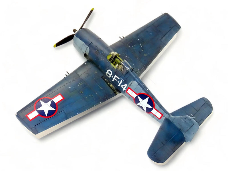 Blue WWII fighter scale model airplane with U.S. star insignia and propeller