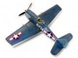 Blue WWII fighter scale model airplane with U.S. star insignia and propeller