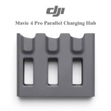 DJI parallel charging hub with three rectangular battery slots, gray plastic