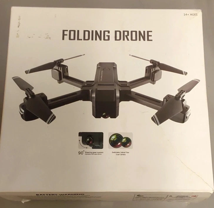 Folding drone package showing quadcopter with front camera and folding arms