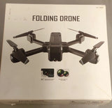 Folding drone package showing quadcopter with front camera and folding arms
