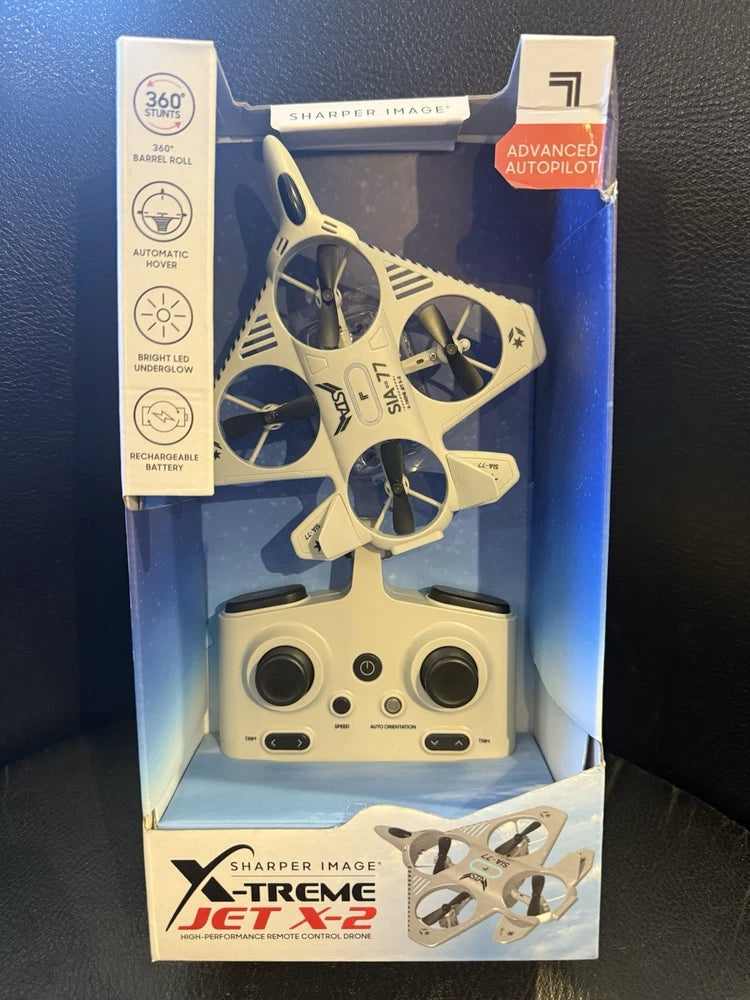 White remote control drone with four propellers, shown in retail box
