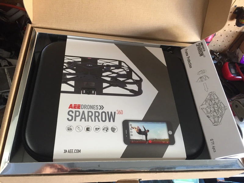 Selfie quadcopter drone kit in open retail box with controller and manual