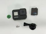 GoPro action camera with battery, 64GB SD card, and mounting clip