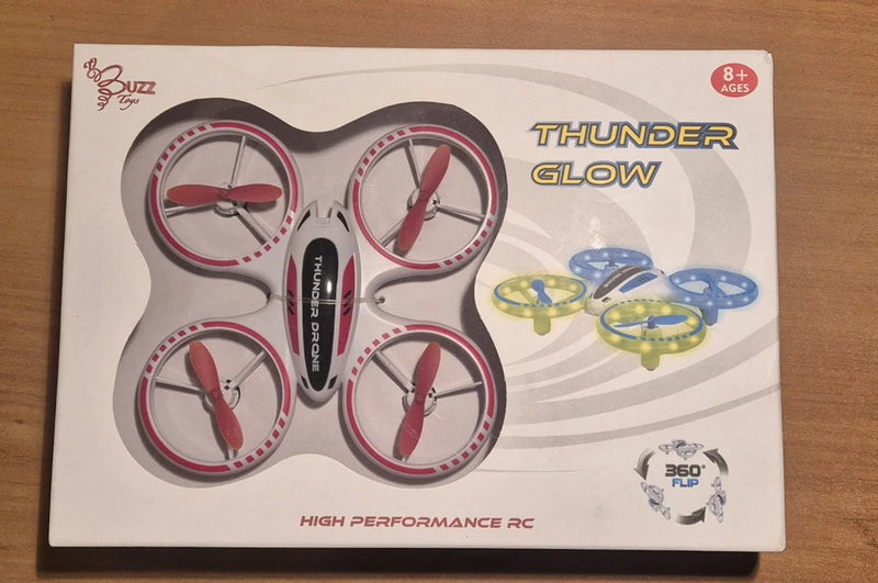 RC Thunder Glow quadcopter drone toy with four propellers on retail box