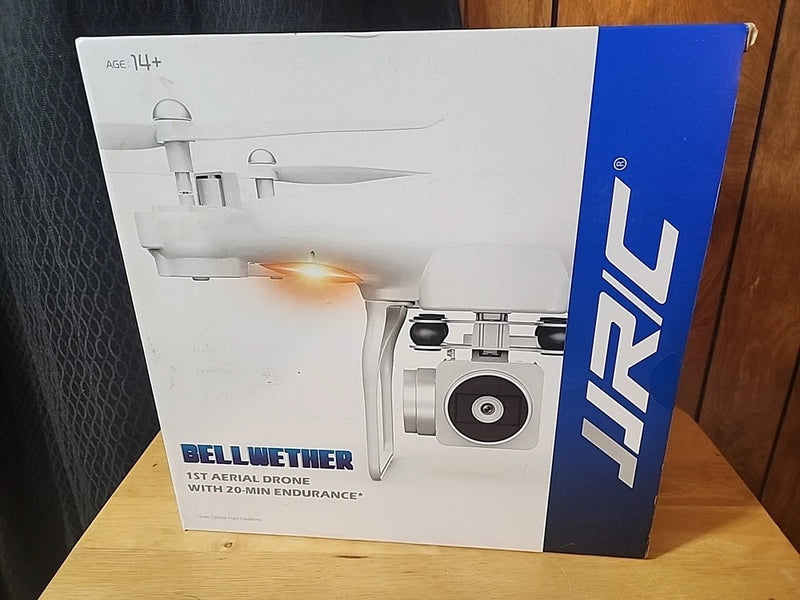 White JJRC aerial drone with camera, shown on retail box packaging