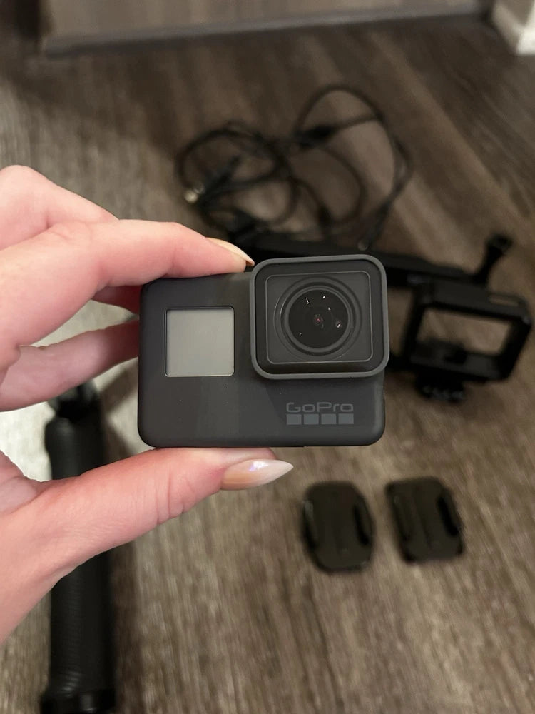 GoPro HERO5 action camera in black, front lens and side LCD screen visible.