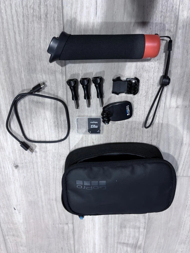 GoPro Hero action bundle: black action camera with red mount, accessories, black carry case