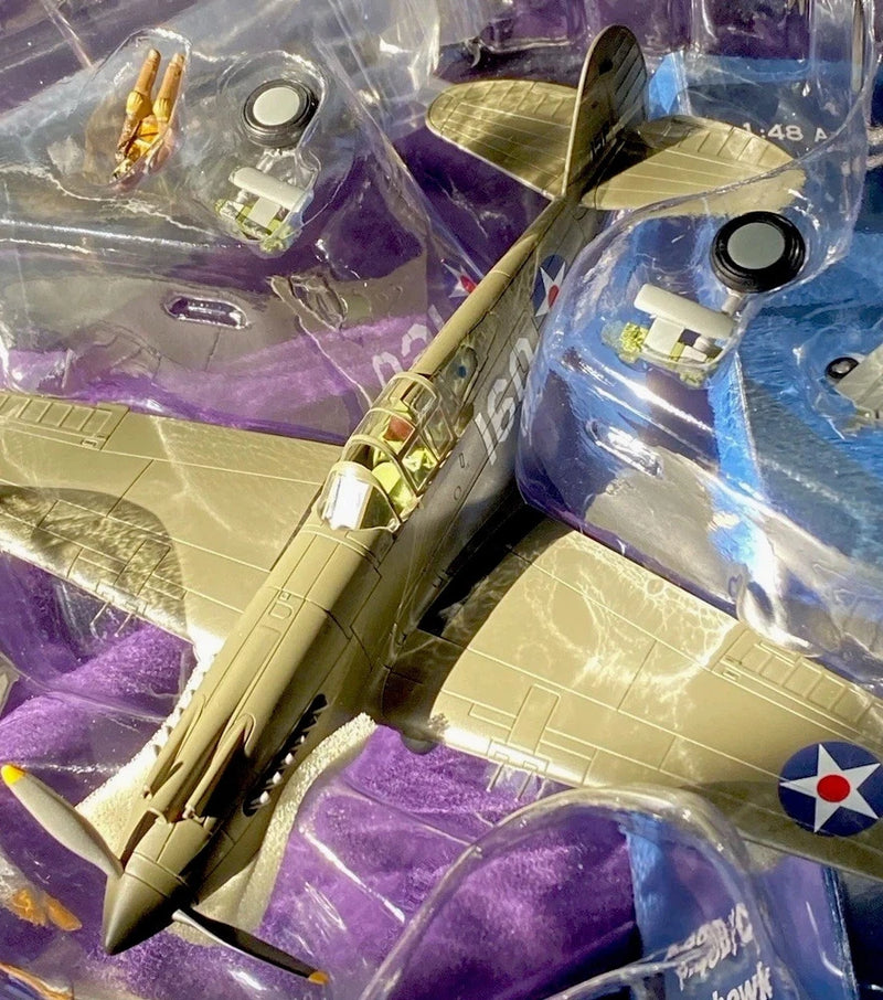 Tan P-40B Warhawk model airplane with propeller and cockpit detail, in blister pack