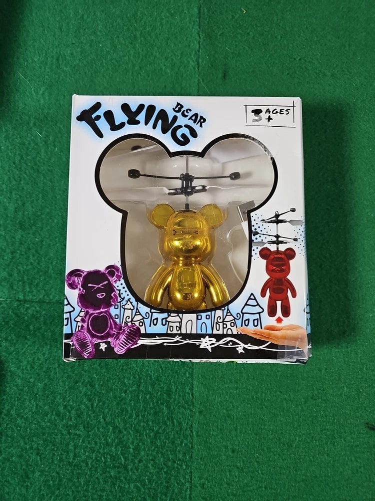 Gold infrared flying bear drone in clear blister pack with four rotors