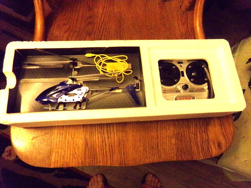 Mini 3-channel helicopter drone kit with controller and coiled charging cable