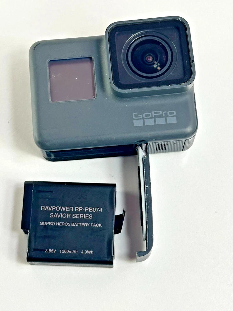 Black GoPro action camera with front lens and detached battery pack