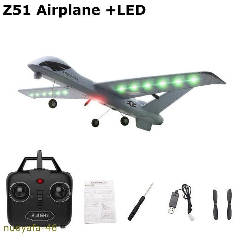 Gray RC glider airplane with green LED lights, 2.4GHz remote controller and accessories