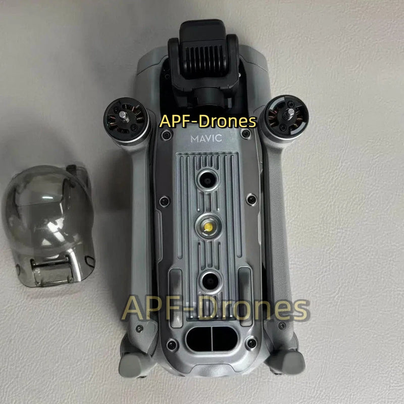 Grey drone body with gimbal camera protector and two visible front propellers