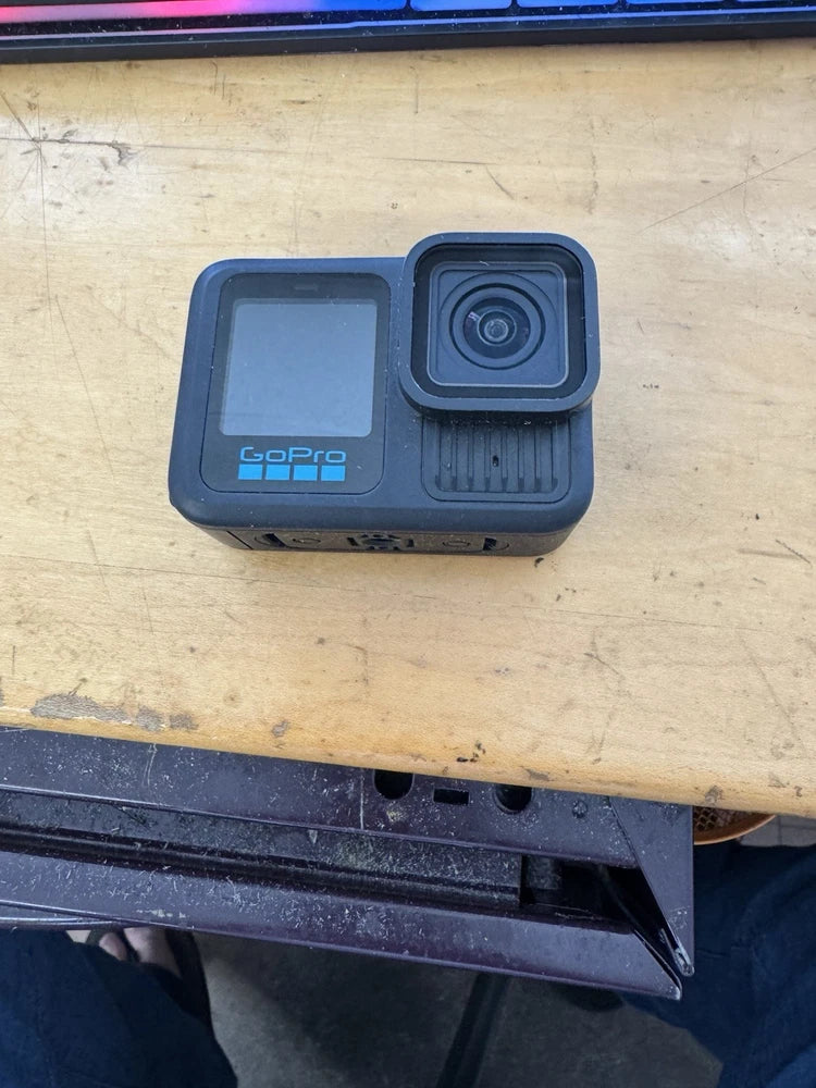 GoPro HERO13 Black action camera with front lens and screen, blue-gray case