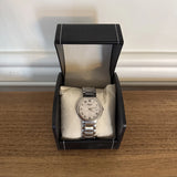 Stainless steel quartz day-date wristwatch with silver dial and metal link bracelet