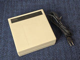 Eveready FCC4 rechargeable battery charger with power cord, beige case