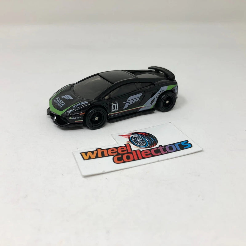Black and green die-cast toy sports car with Hot Wheels Collectors card
