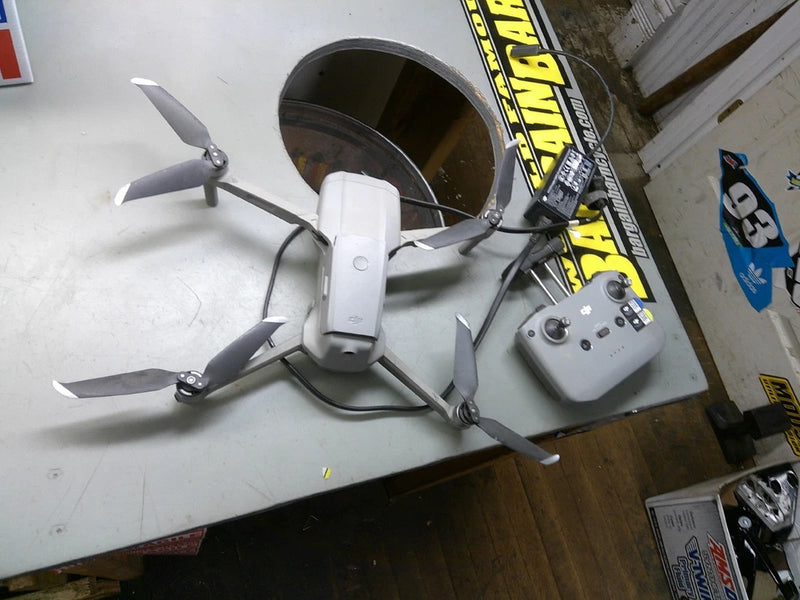 DJI Mavic Pro drone with remote controller and landing arms