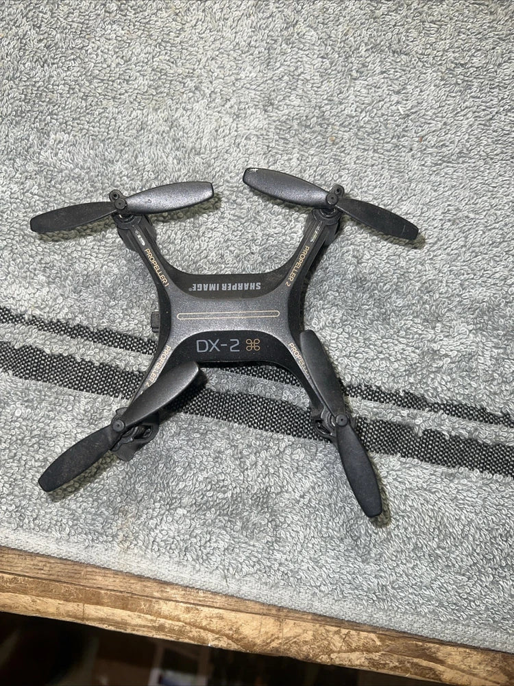 Sharper Image drone with remote control, compact black quadcopter with four propellers