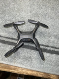 Sharper Image drone with remote control, compact black quadcopter with four propellers