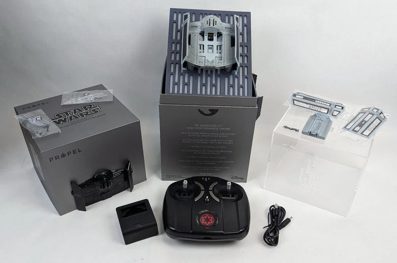 Tie fighter battling drone kit with black controller and accessory parts