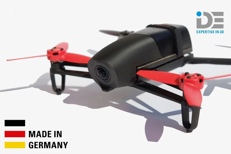 Black plastic drone nose hood with red propellers and camera front