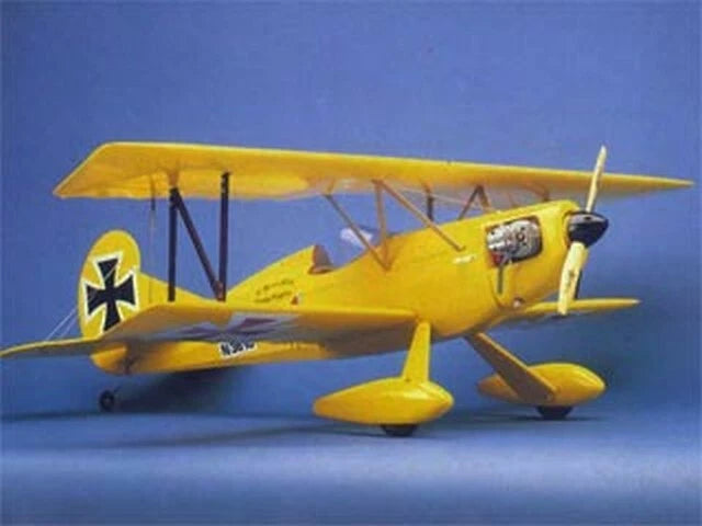 Yellow RC biplane airplane model with twin wings and propeller