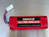 Red RC Ni-Cd battery pack with Nikko Ultra Racing label, 7.2V 1200mAh.