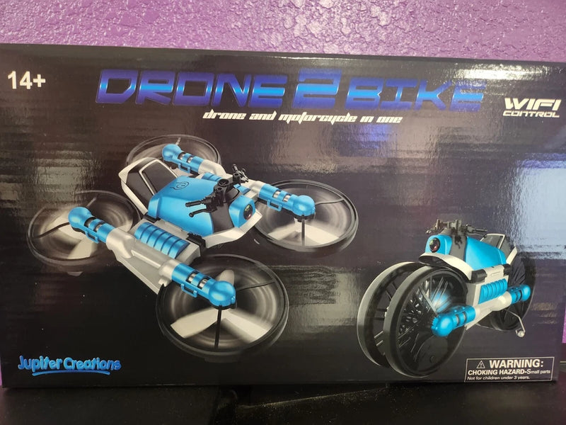 Blue two-in-one drone motorcycle toy with quad-style propeller arms on display