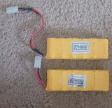 Two yellow rechargeable NiCd battery packs with Diamond Electric Power labels and red wiring