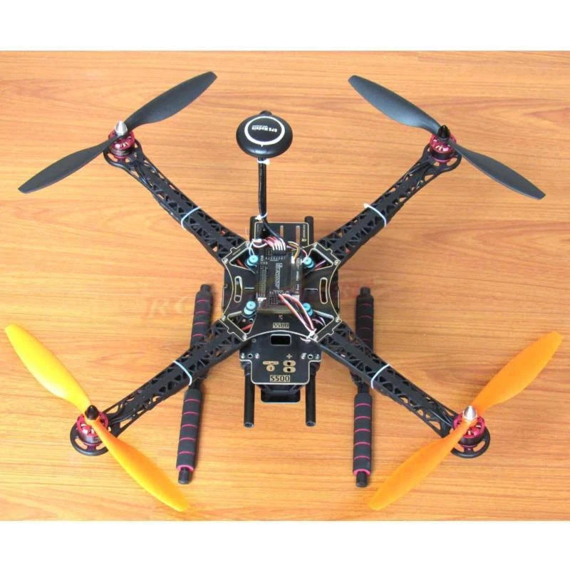 Black DIY quadcopter drone with four propellers and central flight controller board