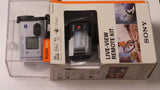 Action cam kit box showing small camera and live-view remote