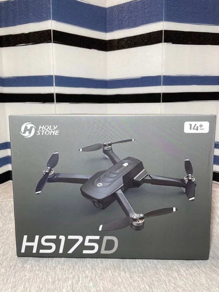 GPS camera drone on retail box, gray body with four black propellers
