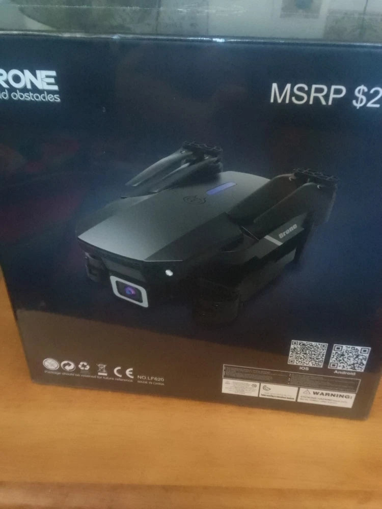 Yomi drone in retail packaging, black foldable quadcopter box front view