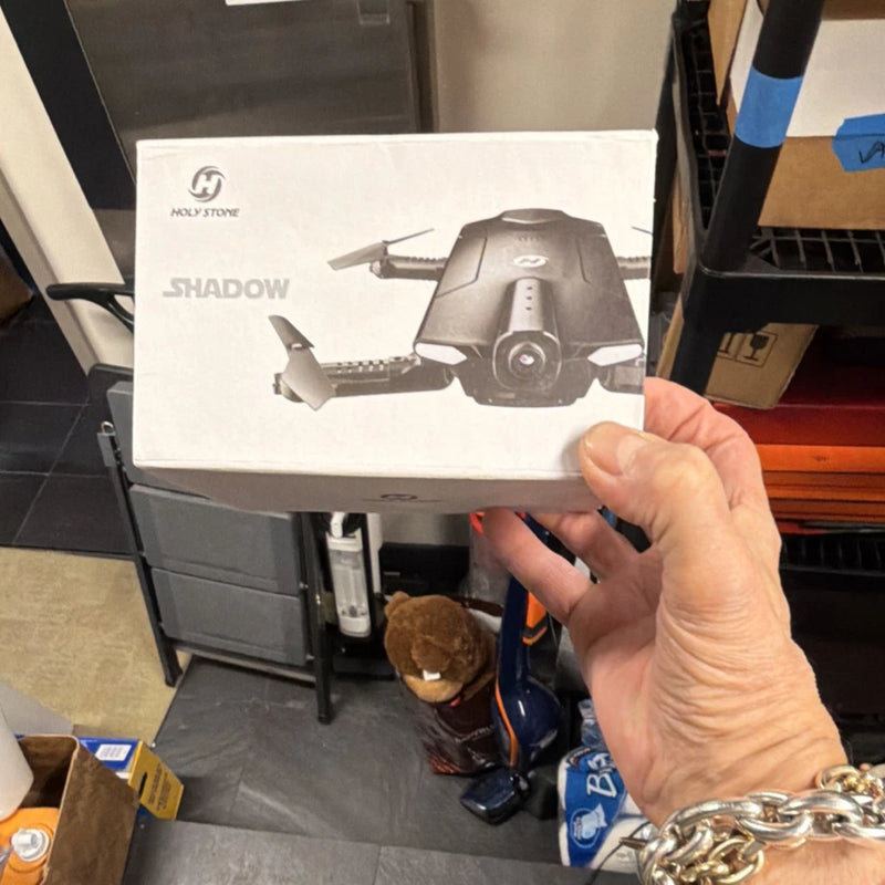 Holy Stone Shadow drone box with printed drone view, camera lens detail