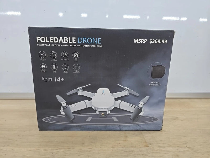 Foldable drone retail box showing quadcopter with HD camera and gesture control, Ages 14+